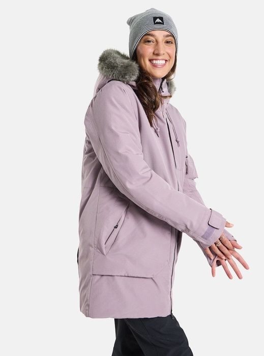 Model wearing a purple parka with a fur-lined hood.