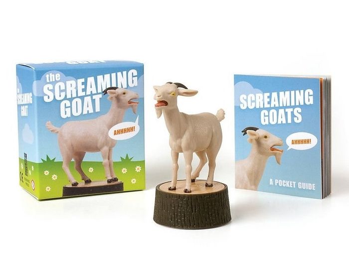 The goat figurine standing on a stump, accompanied by the instruction booklet.