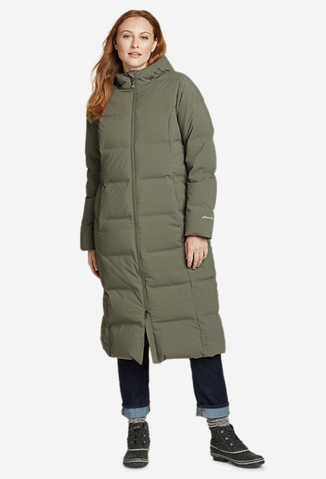 Model wearing a green puffer jacket that extends below the knees