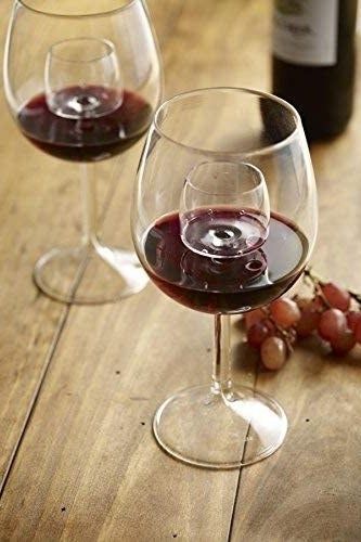 Glasses filled with wine, showing the flow from the aerator.
