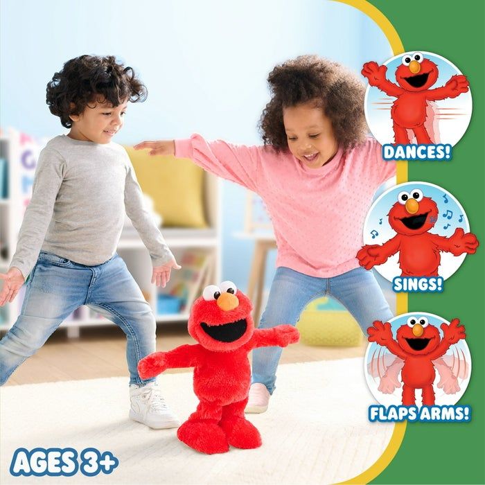 Two kids dancing along with Elmo