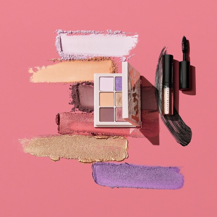 The compact palette and black mascara with swatches displayed