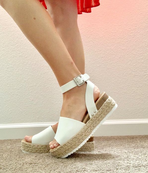 Reviewer rocking the sandals in crisp white
