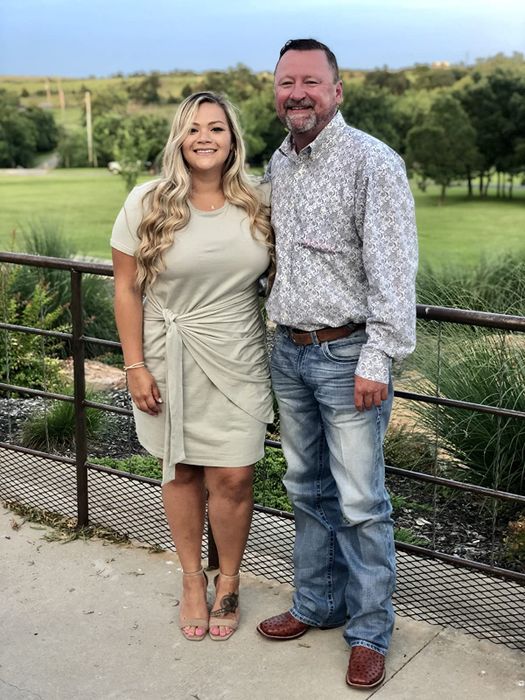 A review photo showing the dress in cream, featuring a stylish knot on the side.