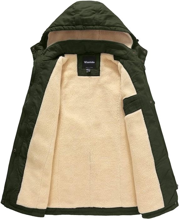 The inside of the coat features a green lining, filled with soft tan fleece for extra warmth.