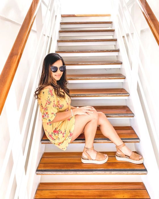 Reviewer wearing the sandals in a warm tan color