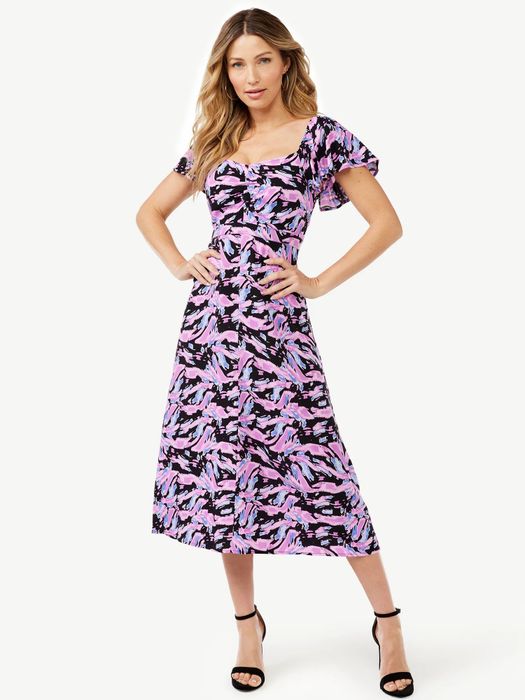 Model wearing the black tiger trip dress