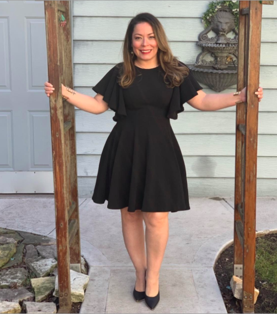 A customer review photo of them looking fabulous in the black version of the dress.