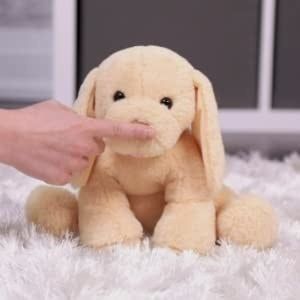 A finger tapping the nose of the adorable puppy figure.