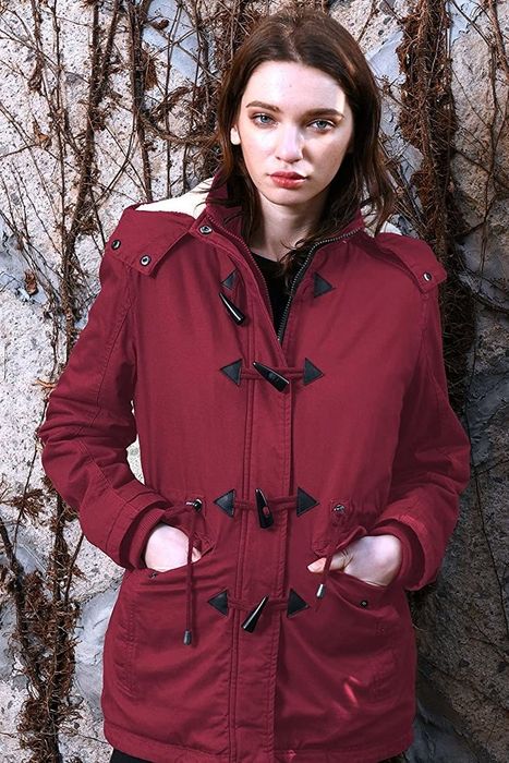 A model rocking the coat in a bold red hue.