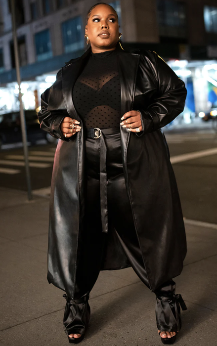 Model rocking a shin-length vegan leather black trench coat