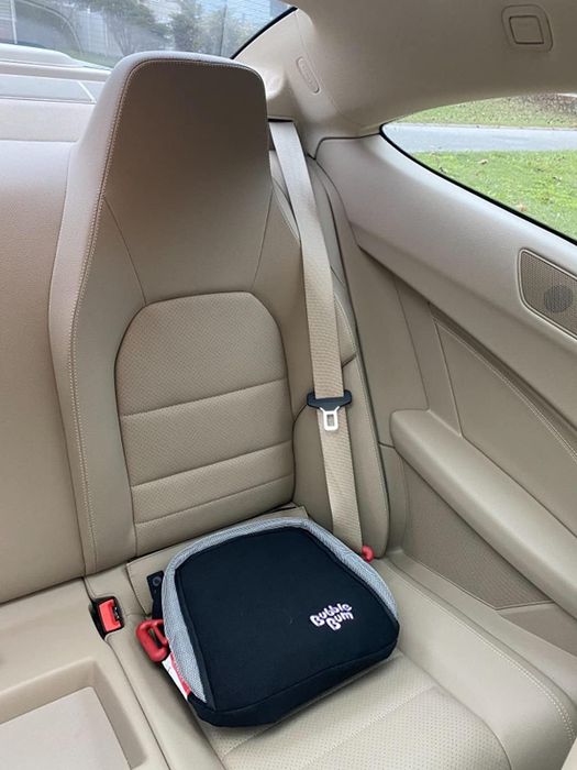 Reviewer’s photo showing the booster seat installed in a car