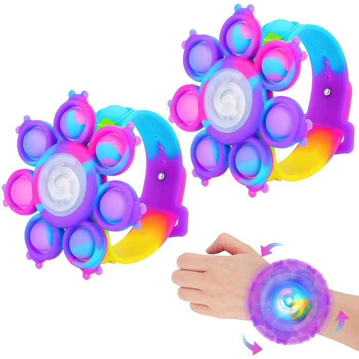 A toddler's wrist with a poppable bracelet spinning around