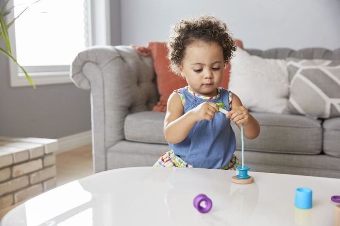 A baby playing with a toy