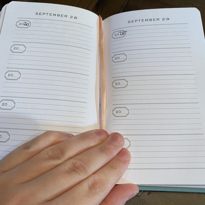The journal opened to two September pages, each with five multi-lined sections labeled
