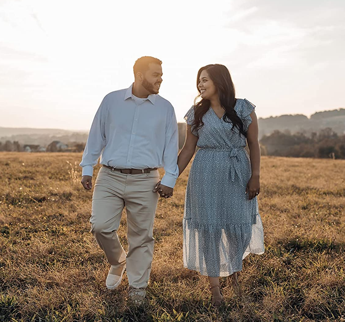 The reviewer is wearing the light blue dress with a mesh-like material at the bottom tier.
