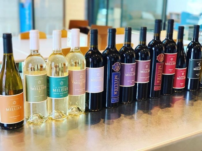 An assortment of wine bottles neatly arranged on a table.