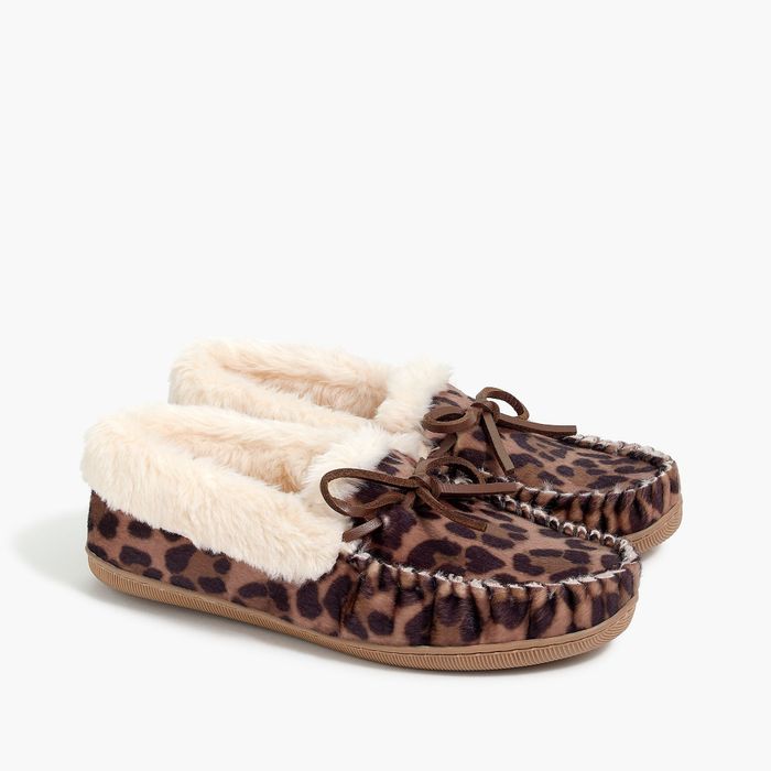 A pair of brown animal print slippers