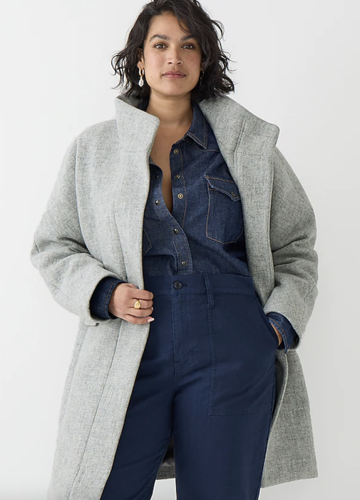 Model wearing a long grey wool trench coat.