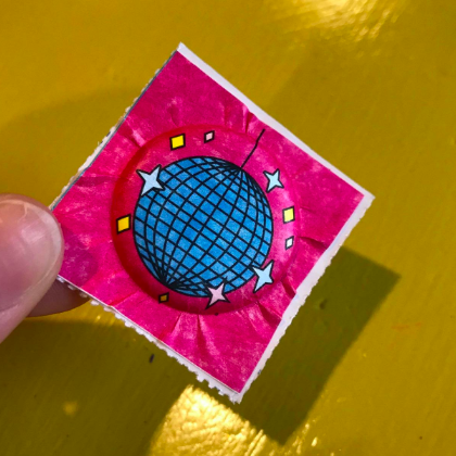 The final sticker after being completed in the press.