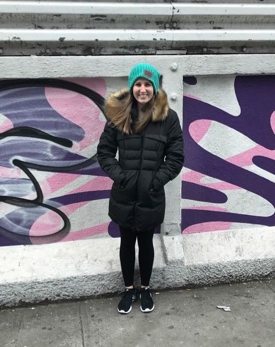 A reviewer in the coat in black