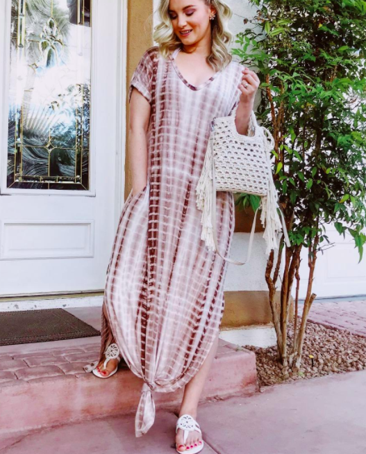 A customer review photo showcasing the dress in a warm coffee color.