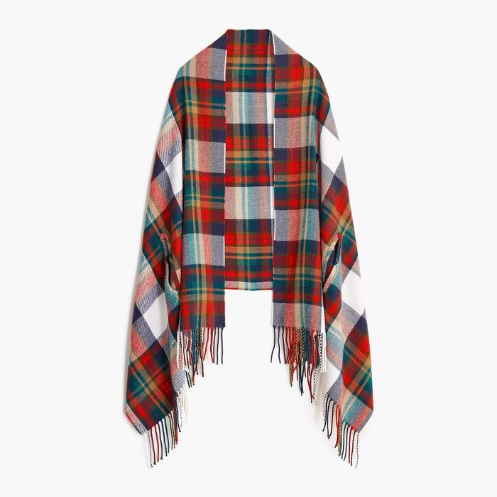 A plaid scarf featuring brown, blue, yellow, green, and red tones