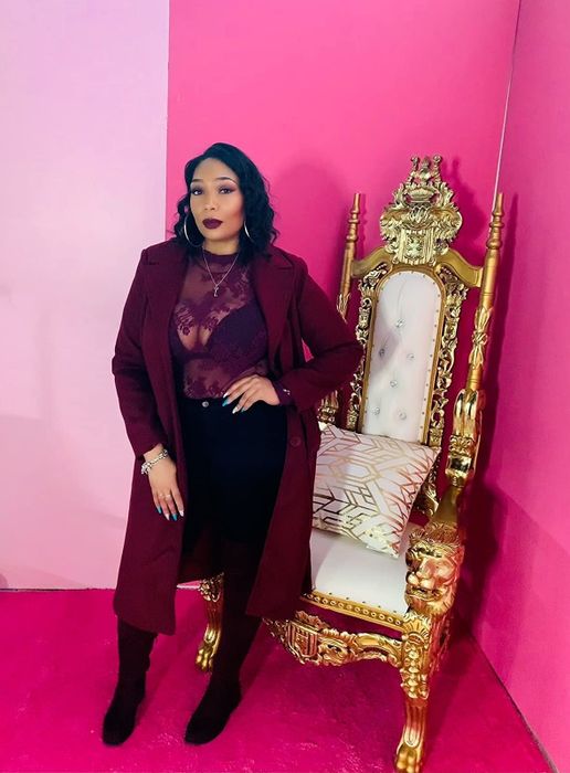 Another reviewer showcasing the long coat in rich burgundy