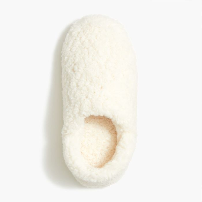 A pair of white fuzzy slippers