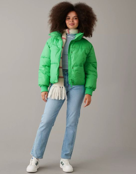 A model rocking a green puffer coat.