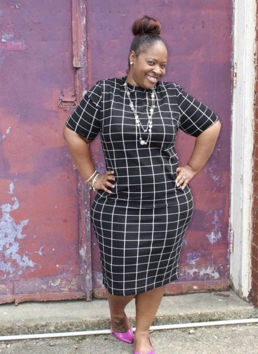 A reviewer shares a photo of someone in a black geometric-patterned dress.