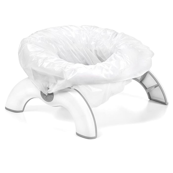 Compact plastic potty seat designed for toddlers, perfect for travel, and easy to store away when not in use.