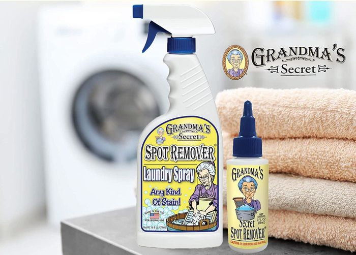 A large white spray bottle alongside a smaller spot remover gel bottle.