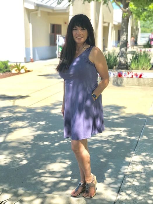 A customer photo featuring the T-shirt dress in a purple-gray shade.