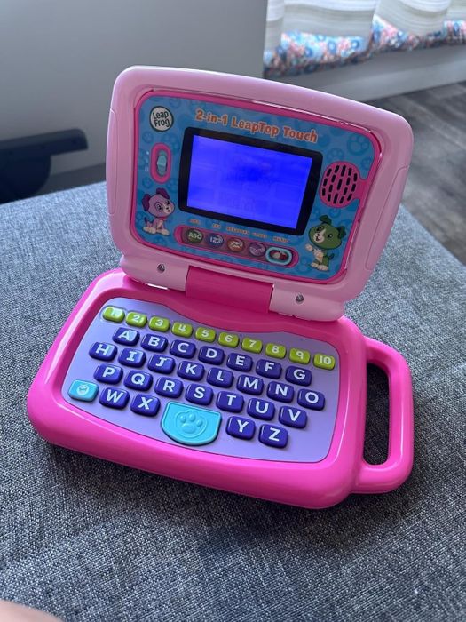Toy laptop opened up to show its keyboard