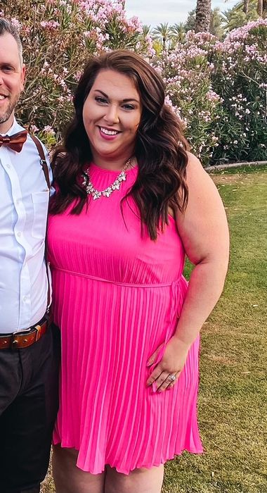 Another reviewer in the vibrant hot pink dress
