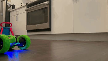 A reviewer's video showcasing the green remote-control car in action