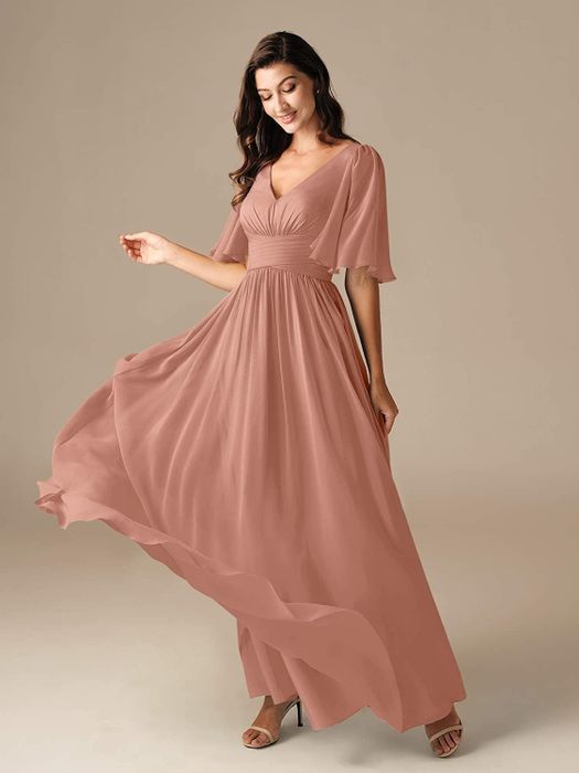 A model showcases the mauve dress, highlighting the front view of the beautiful design.