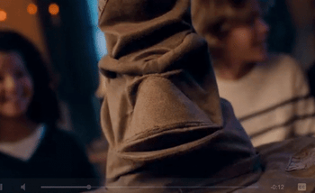 GIF of the brown Sorting Hat speaking.