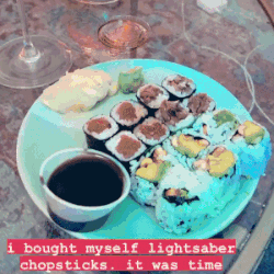 Mytour editor using the glowing blue chopsticks to eat sushi.