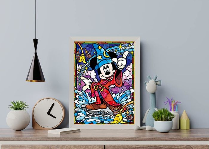 A framed diamond art piece featuring Sorcerer Mickey