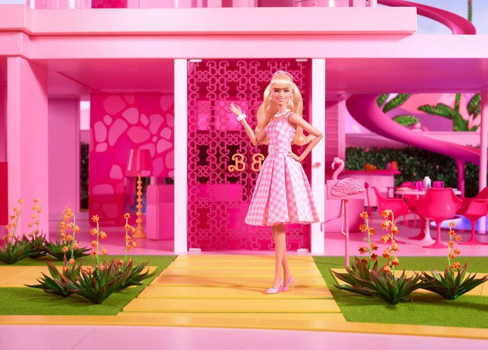 The doll placed inside a Barbie Dreamhouse