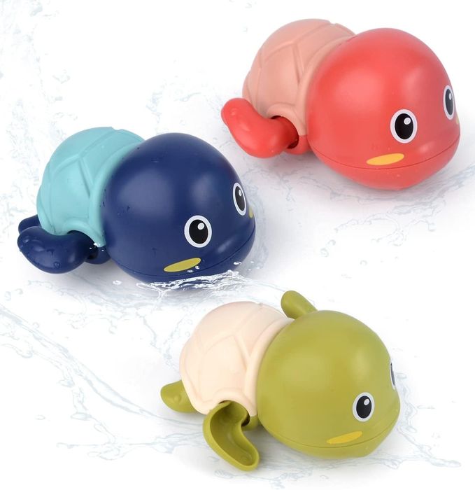 Three wind-up turtle toys lined up