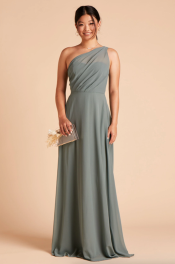 A model showcasing the seafoam-colored gown