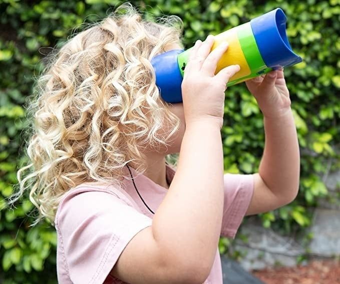 Child peering through binoculars