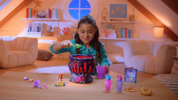 A gif of a child playing with Ursula's mystical cauldron.