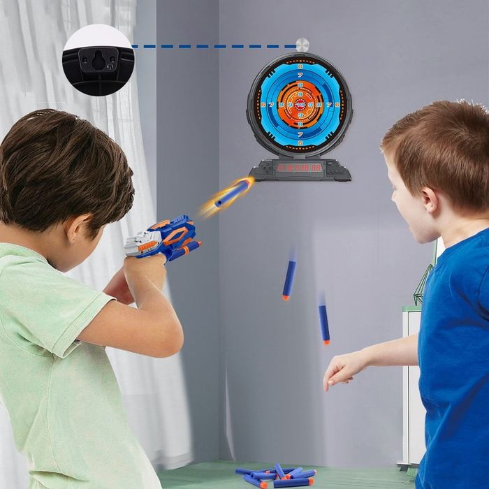 Two kids aiming their blasters at the dartboard, ready for action.