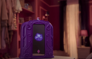A magic mirror with a doll emerging from it