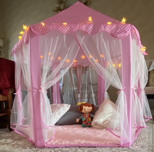 A reviewer’s pink castle tent adorned with star lights
