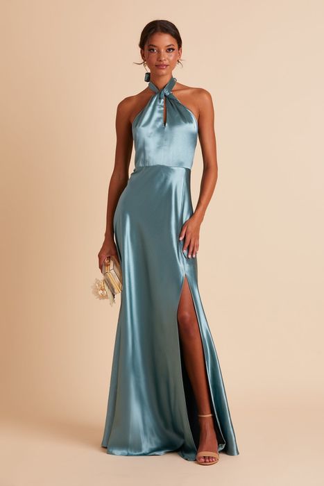 A model models the dress in a stunning blue shade.